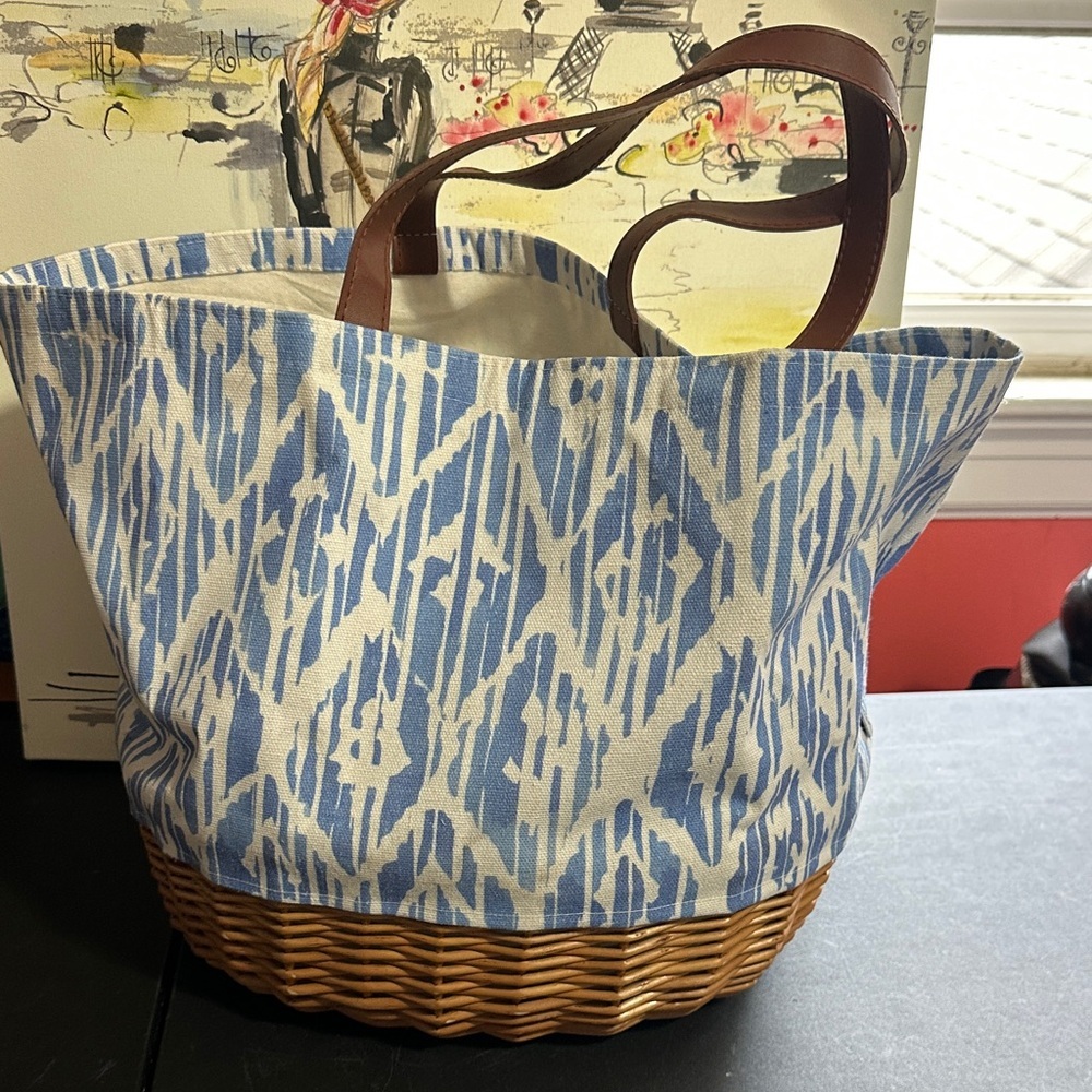Picnic time wicker basket with utensils and glasses